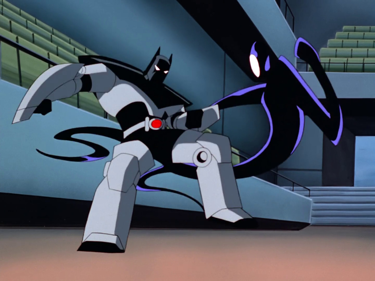 Batman (Bruce Wayne) fighting Inque in an armored exoskeleton.