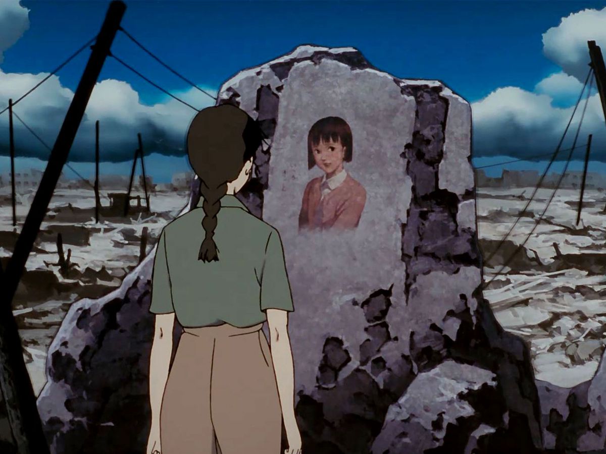 Chiyoko&nbsp;stares at a portrait of her younger self among the ruins of a devastated city