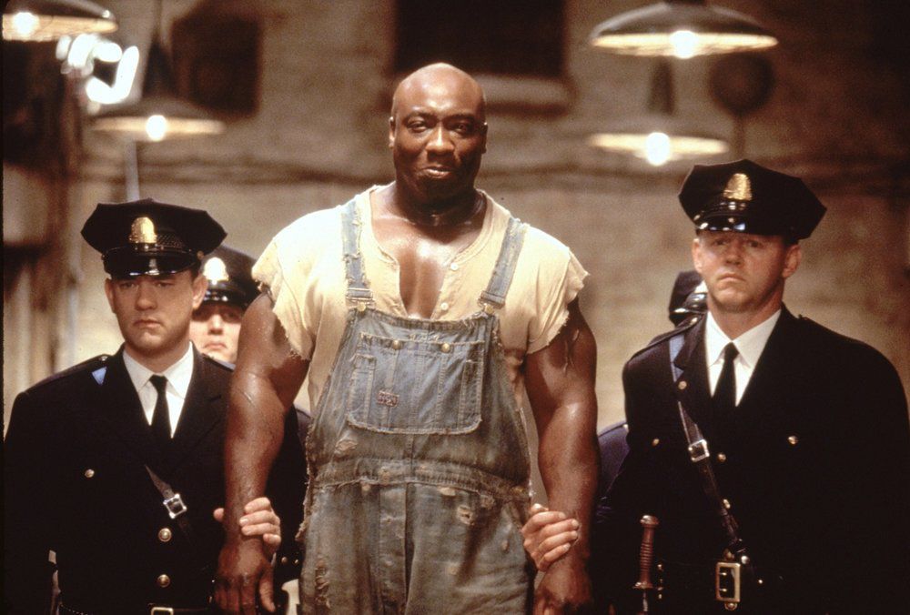 Tom Hanks and Michael Clarke Duncan as Paul Edgecomb and inmate John Coffrey in The Green Mile