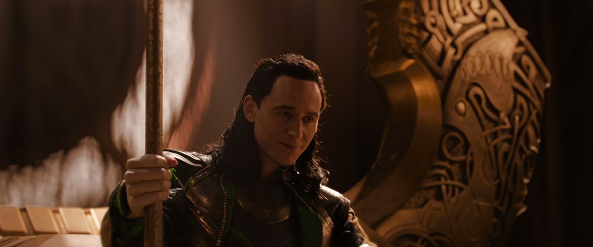 Loki sits on Odin’s throne in a credits scene from Thor: The Dark World. 