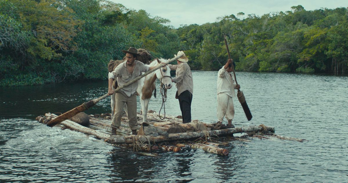 Three men and a pack horse on a raft in a river, mid-jungle, in Tragic Jungle