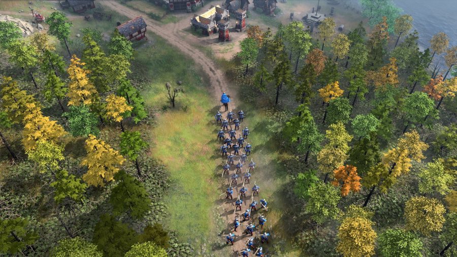 A king in age of empires 4 leads a column of men towards a town