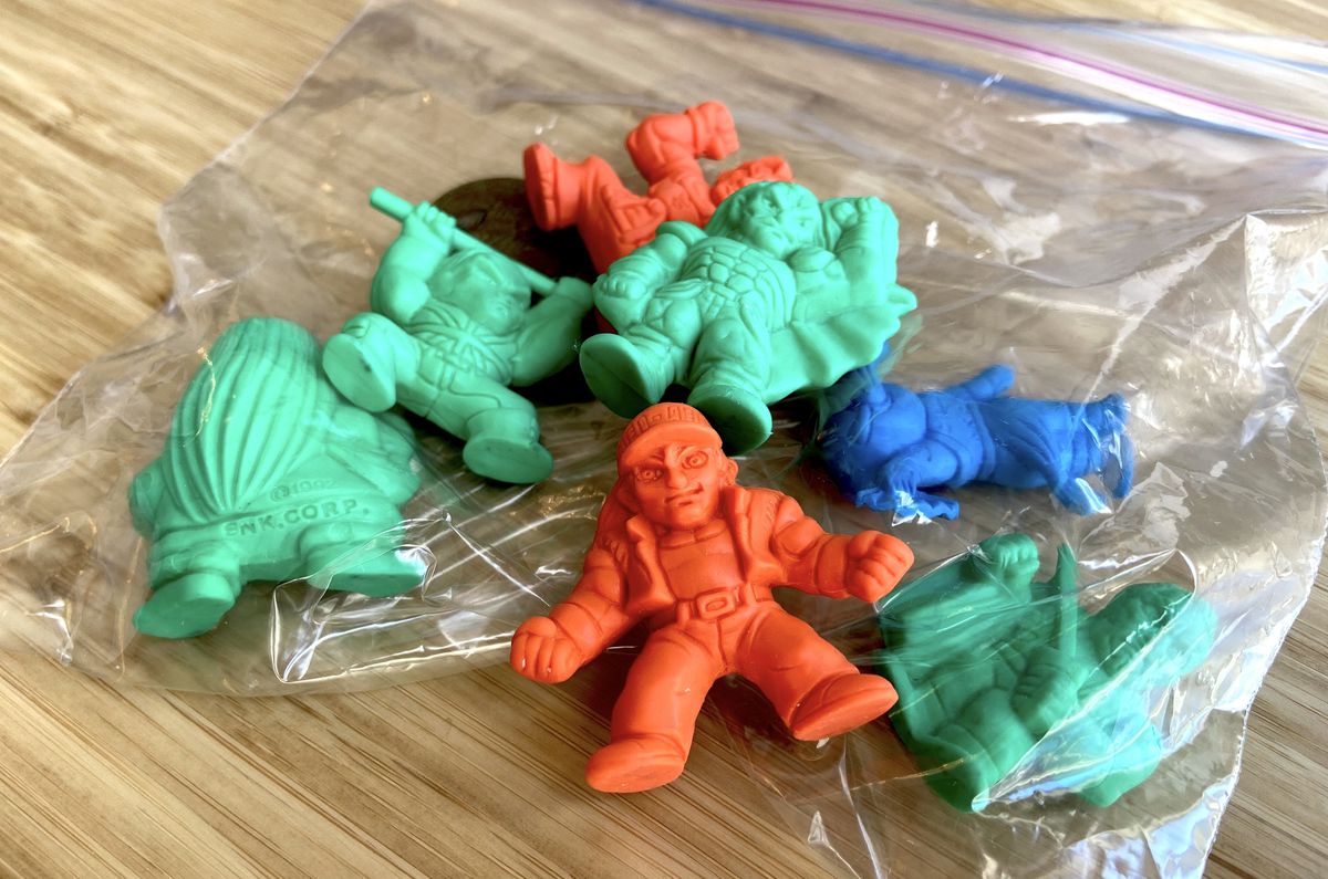 green, red, and blue Fatal Fury figurines in a Ziploc bag