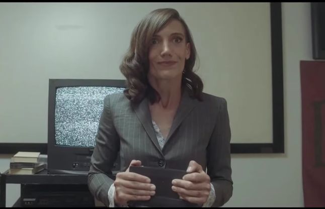 Devolver Digital's fictional chief synergy officer Nina Struthers, played by Mahria Zook