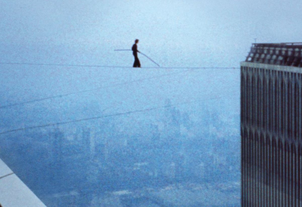 Philippe Petit balancing between the Twin Towers