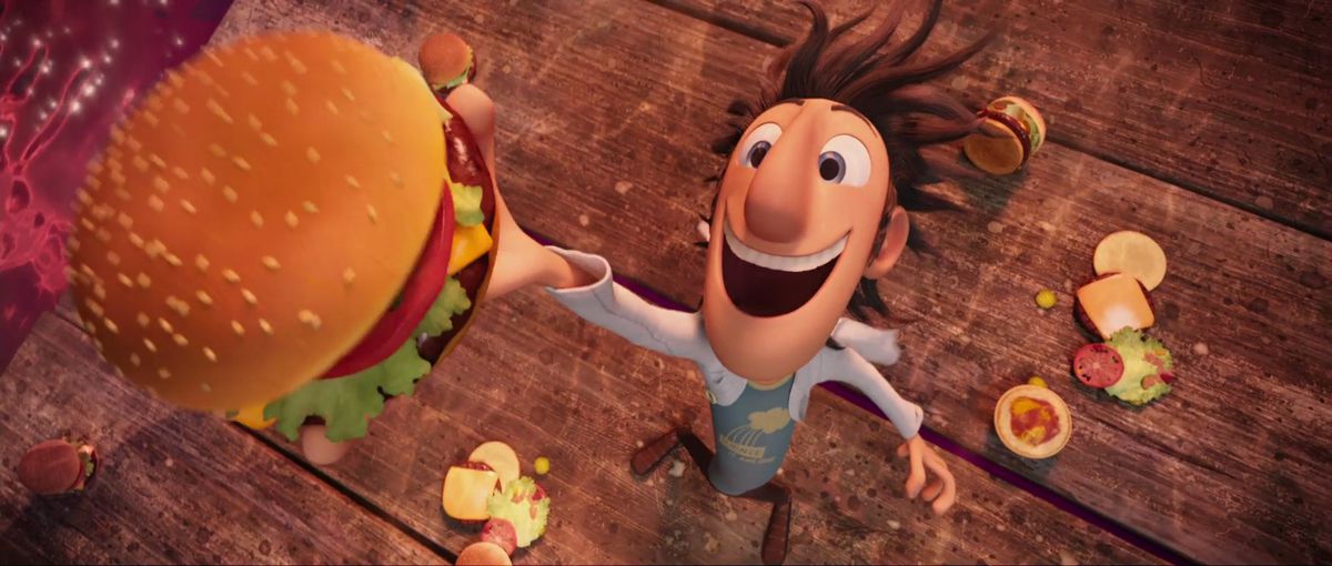 Flint grabs a hamburger out of the sky in a screencap from Cloudy with a Chance of Meatballs