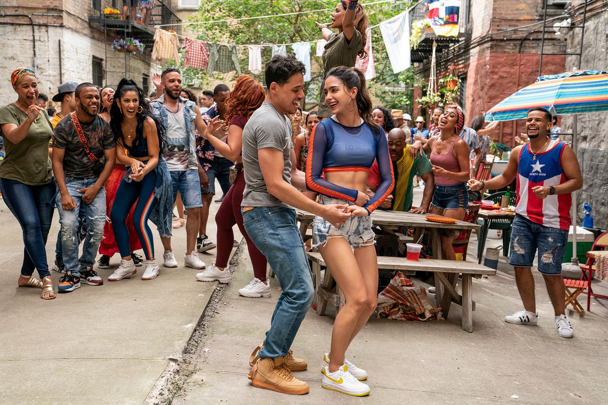 Usnavi and Vanessa dancing in front of a crowd in In the Heights