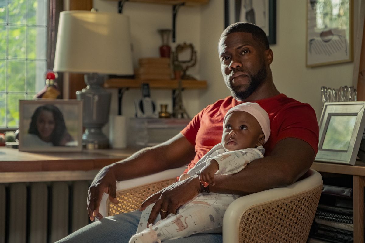 Kevin Hart holding a baby in Fatherhood
