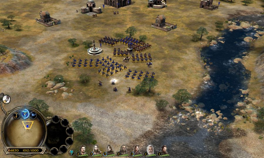 An entire army of men, including several of the legendary heroes like Aragon and Gandalf, are standing close to a monument. There's a river flowing to the east and several training facilities to the north.