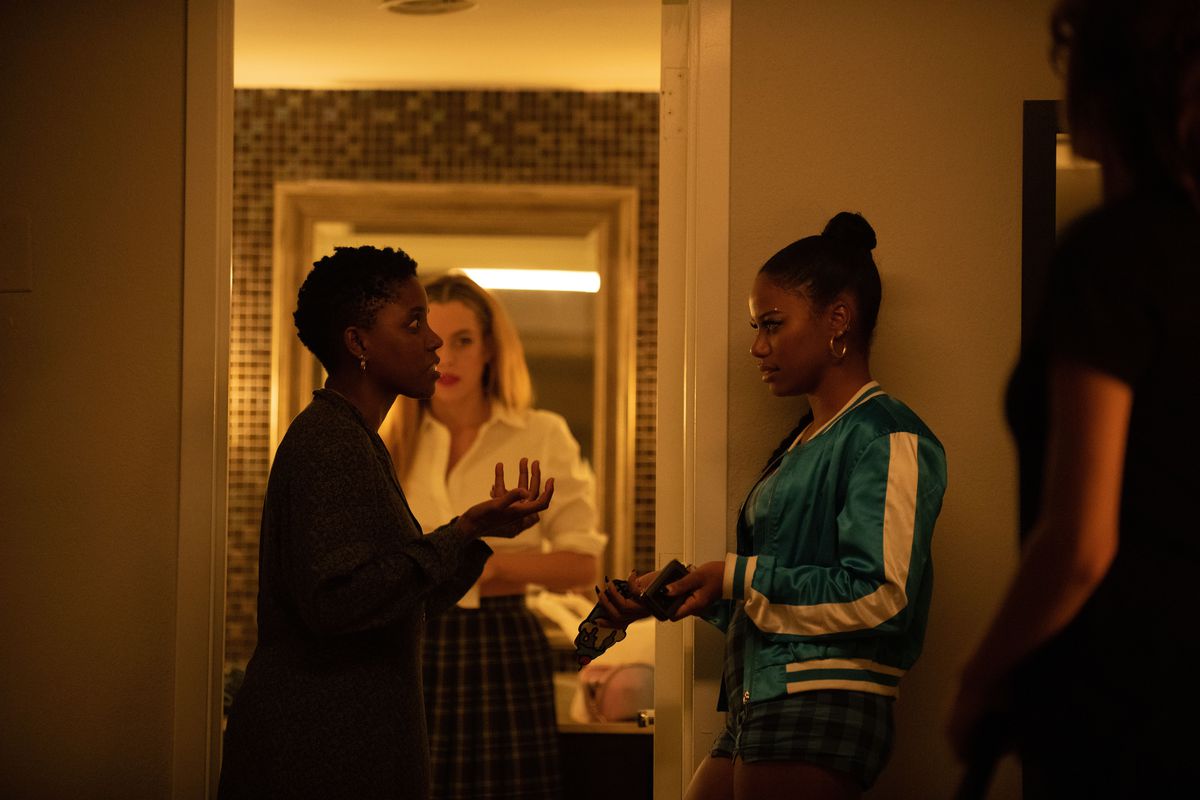 Janicza Bravo directing Taylour Paige with Riley Keough in the background during the filming of Zola