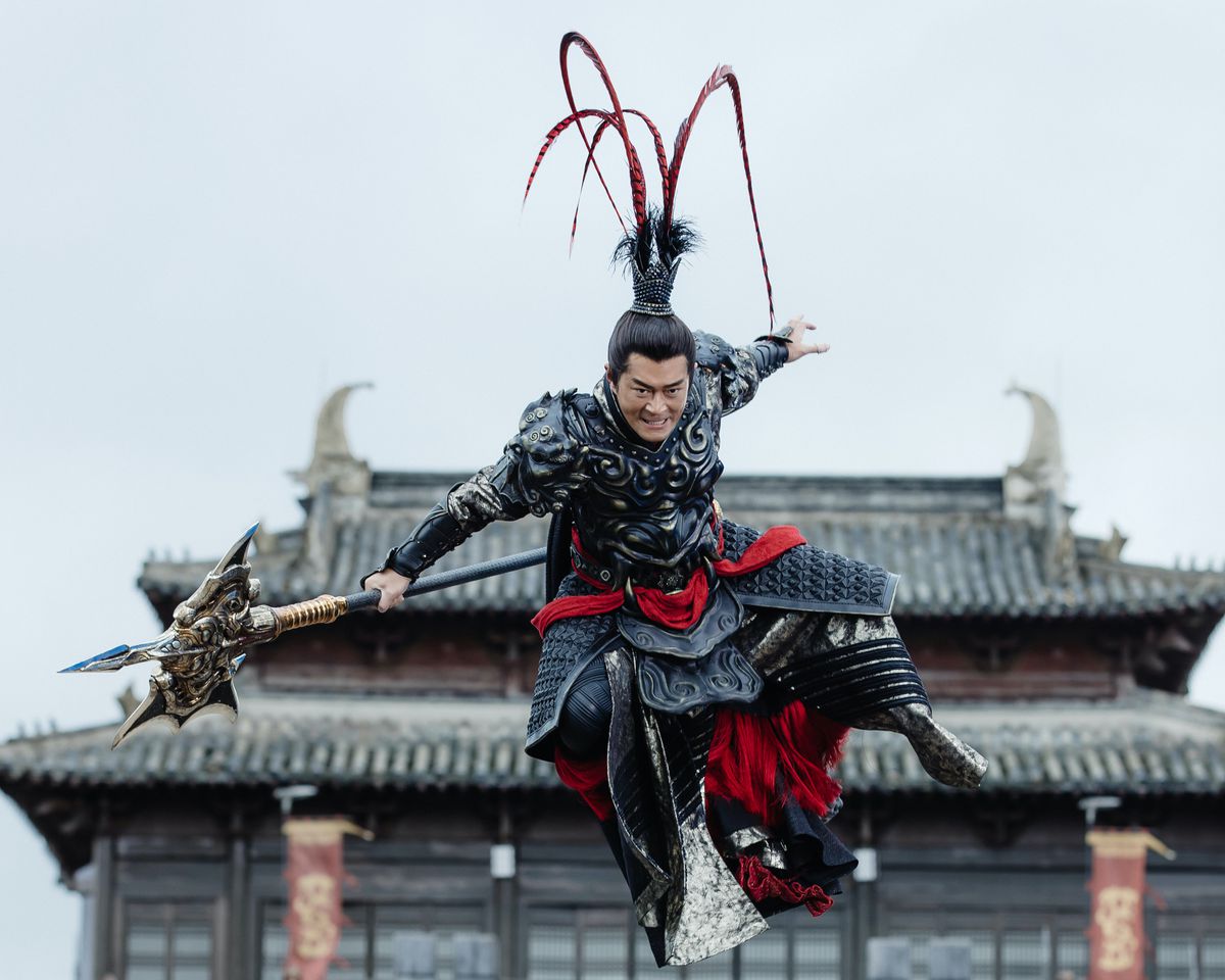 An armored warrior in an elaborate feathered helmet leaps through the air in Netflix’s Dynasty Warriors