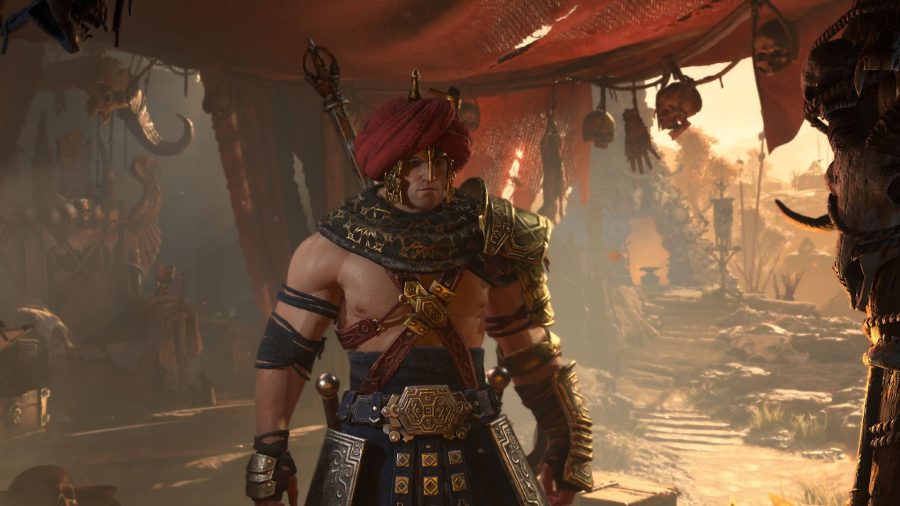 A barbarian in Diablo 4 wearing a turban in the middle of a middle-eastern style market.
