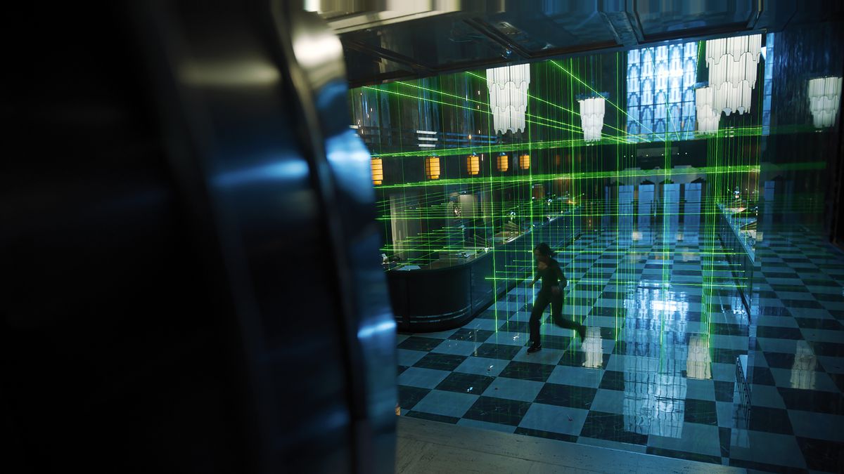 Zoey from Escape Room: Tournament of Champions jumps through a high-security laser grid