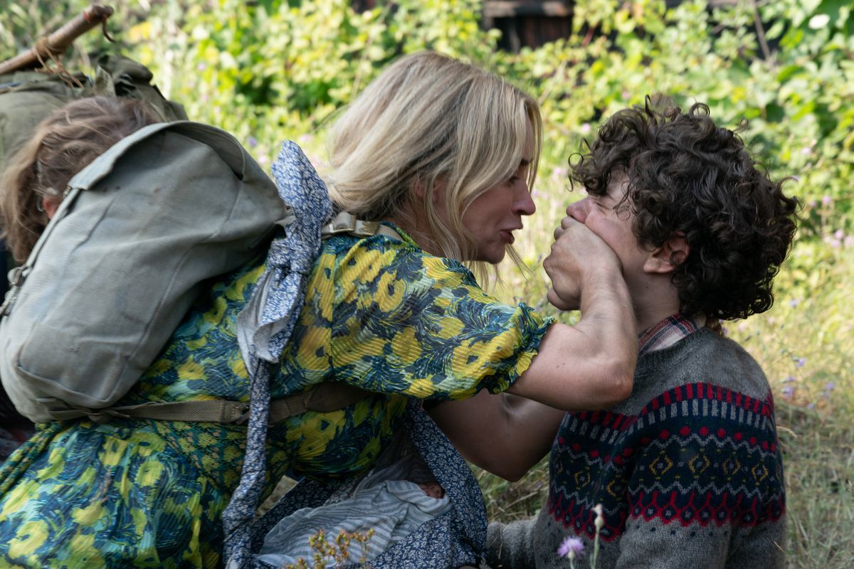 Evelyn (Emily Blunt) puts her hand over Marcus’ (Noah Jupe) mouth in A Quiet Place Part II