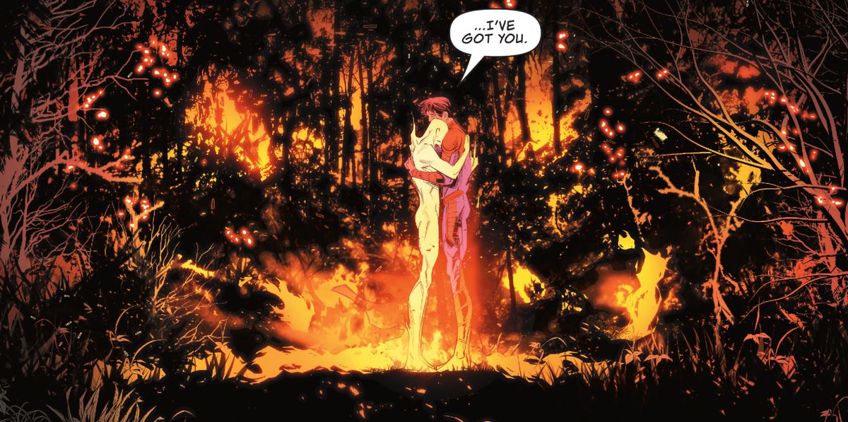 “I’ve got you,” Jon Kent/Superman says, hugging a flaming and naked male figure at the center of a forest fire in Superman: Son of Kal-El #1 (2023).