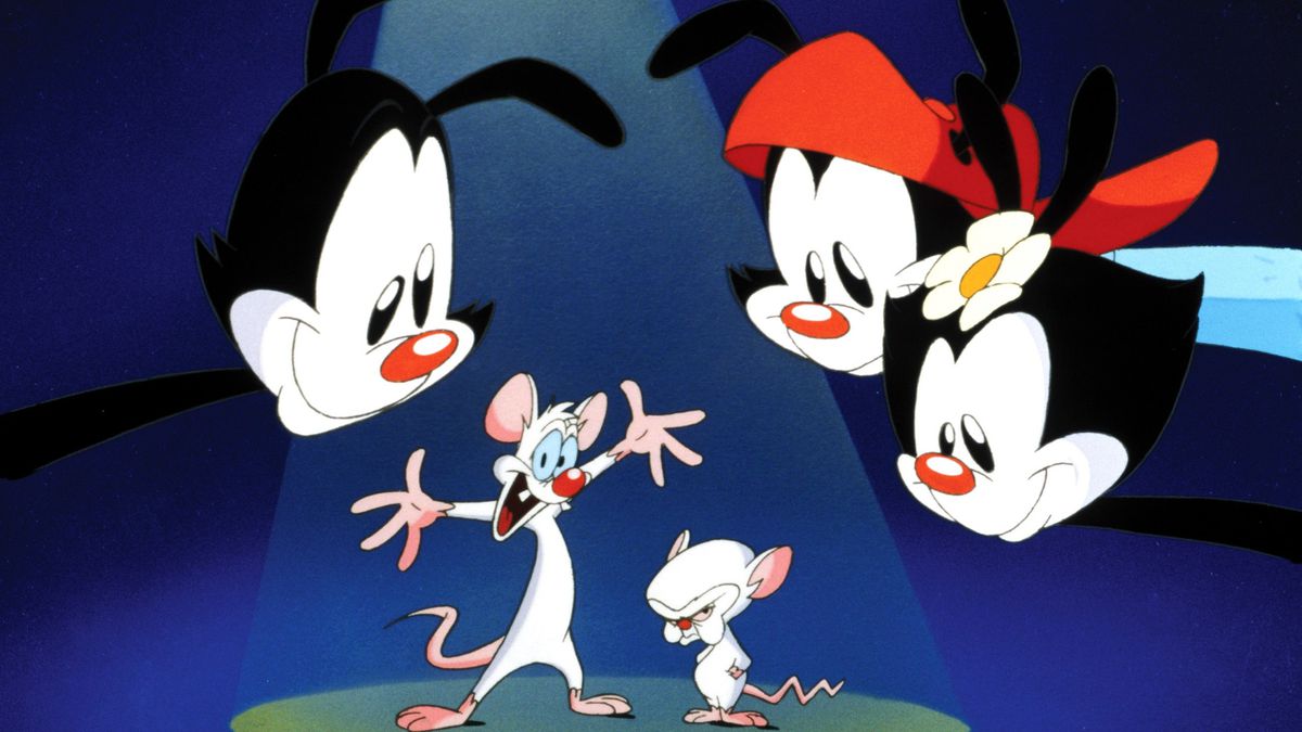 An image from an Animaniacs opening, with Yakko, Wakko, and Dot leaning over Pinky and the Brain in front of an abstract background