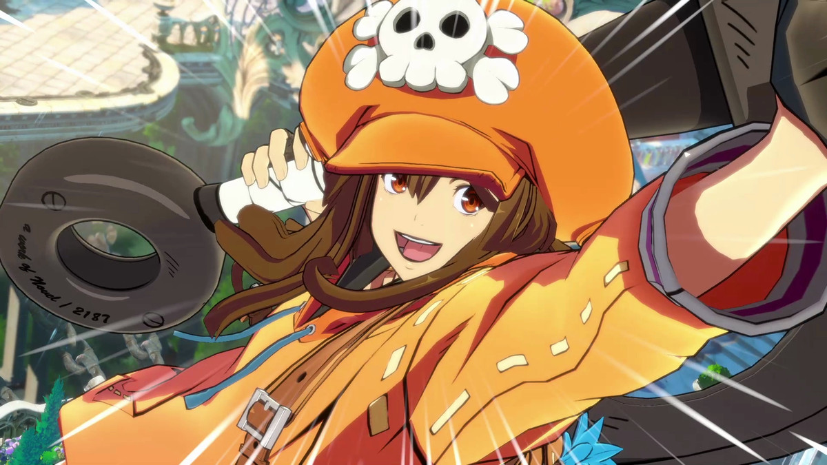 Guilty Gear character May smiles at the camera, wearing a bright orange outfit