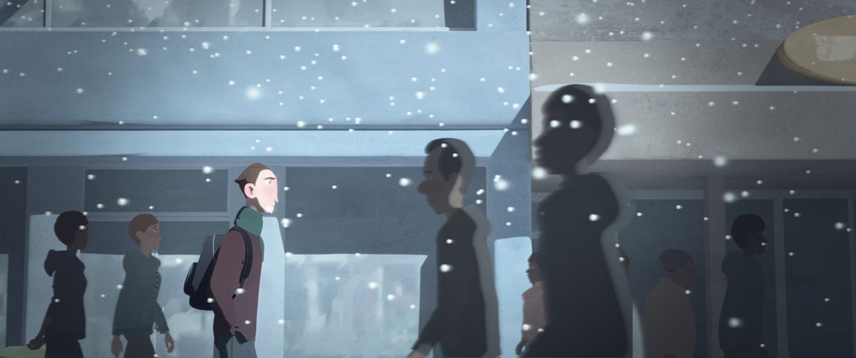 a young man walking home as snow falls