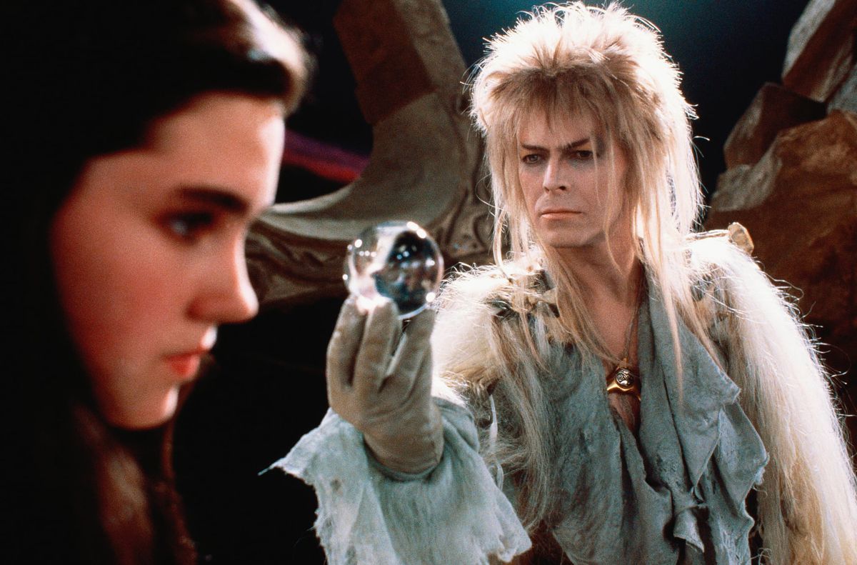 David Bowie as Jareth in Labyrinth offers a glass ball to Jennifer Connelly as Sarah