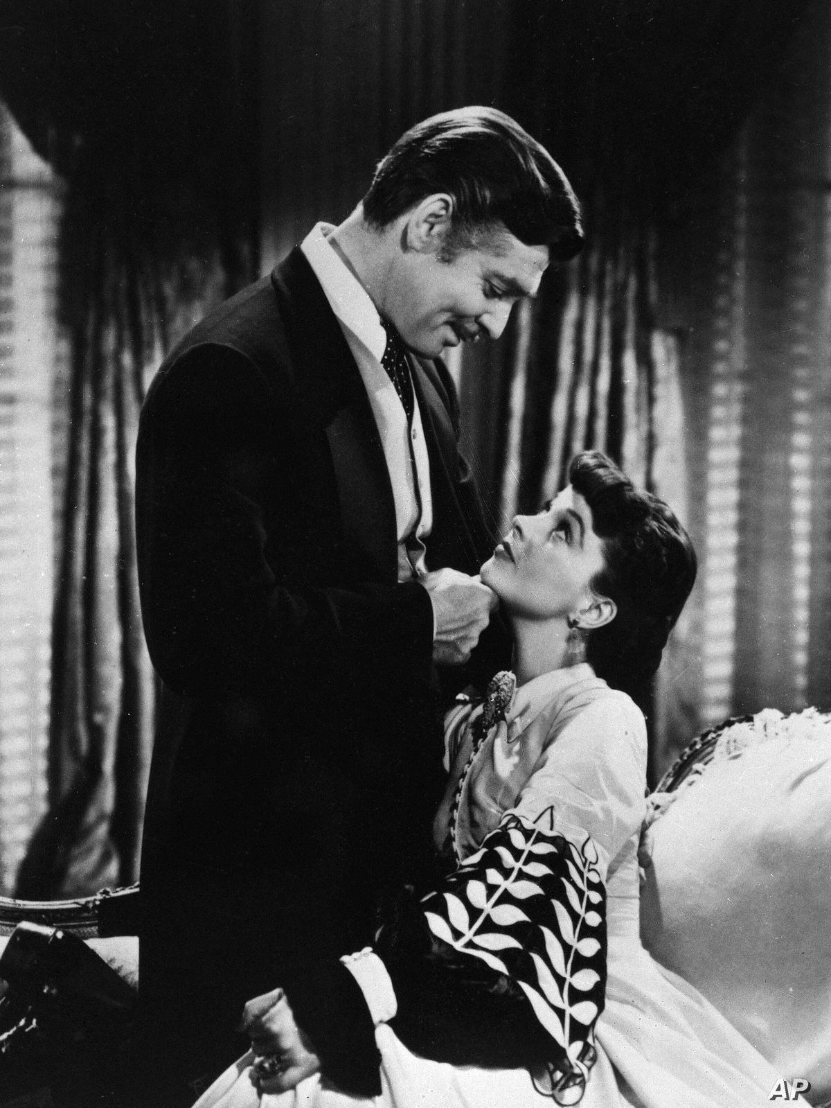 Clark Gable as Rhett Butler condescendingly chucks Scarlett O’Hara’s chin in Gone With the Wind