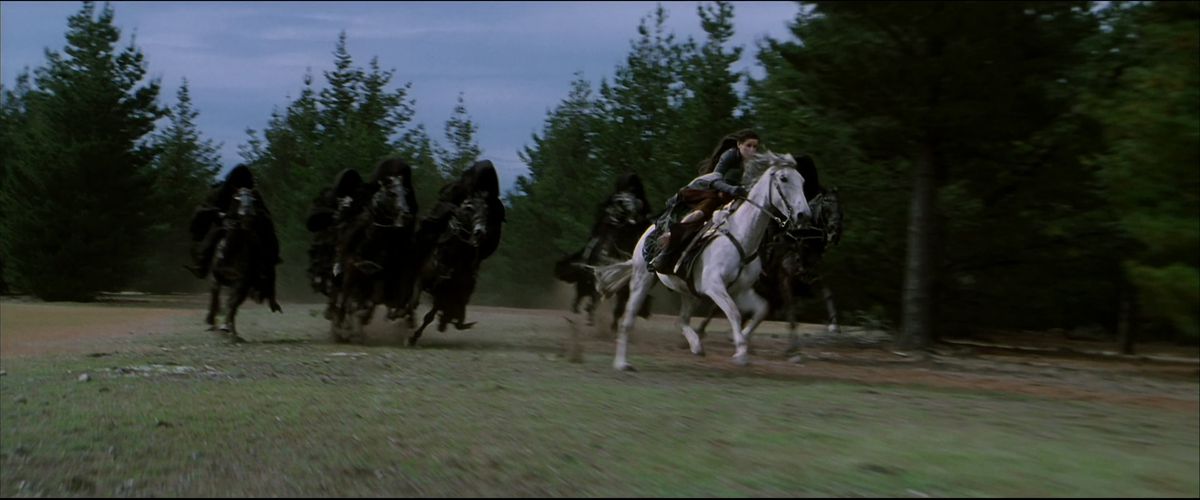Arwen races away from the Dark Riders on the back of a beautiful white horse in The Fellowship of the Ring. 