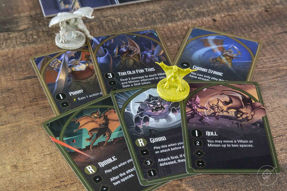 A card says “Too old for this” and allows the Gargoyle to damage every enemy within range.