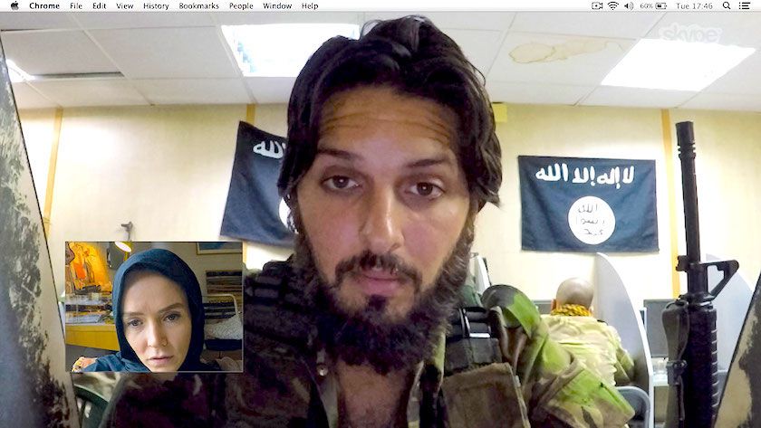Investigative journalist Amy (Valene Kane) speaks to ISIS recruiter Abu Bilel Al-Britani (Shazad Latif) via a videochat window in Profile.