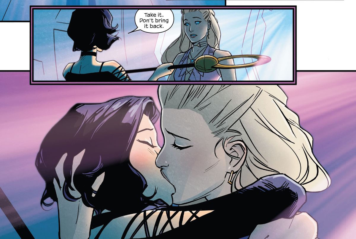 “Take it,” Says Niko, handing Karolina the Staff of One. “Don’t bring it back.” The two girlfriends embrace in a passionate kiss in Runaways #38 (2023).
