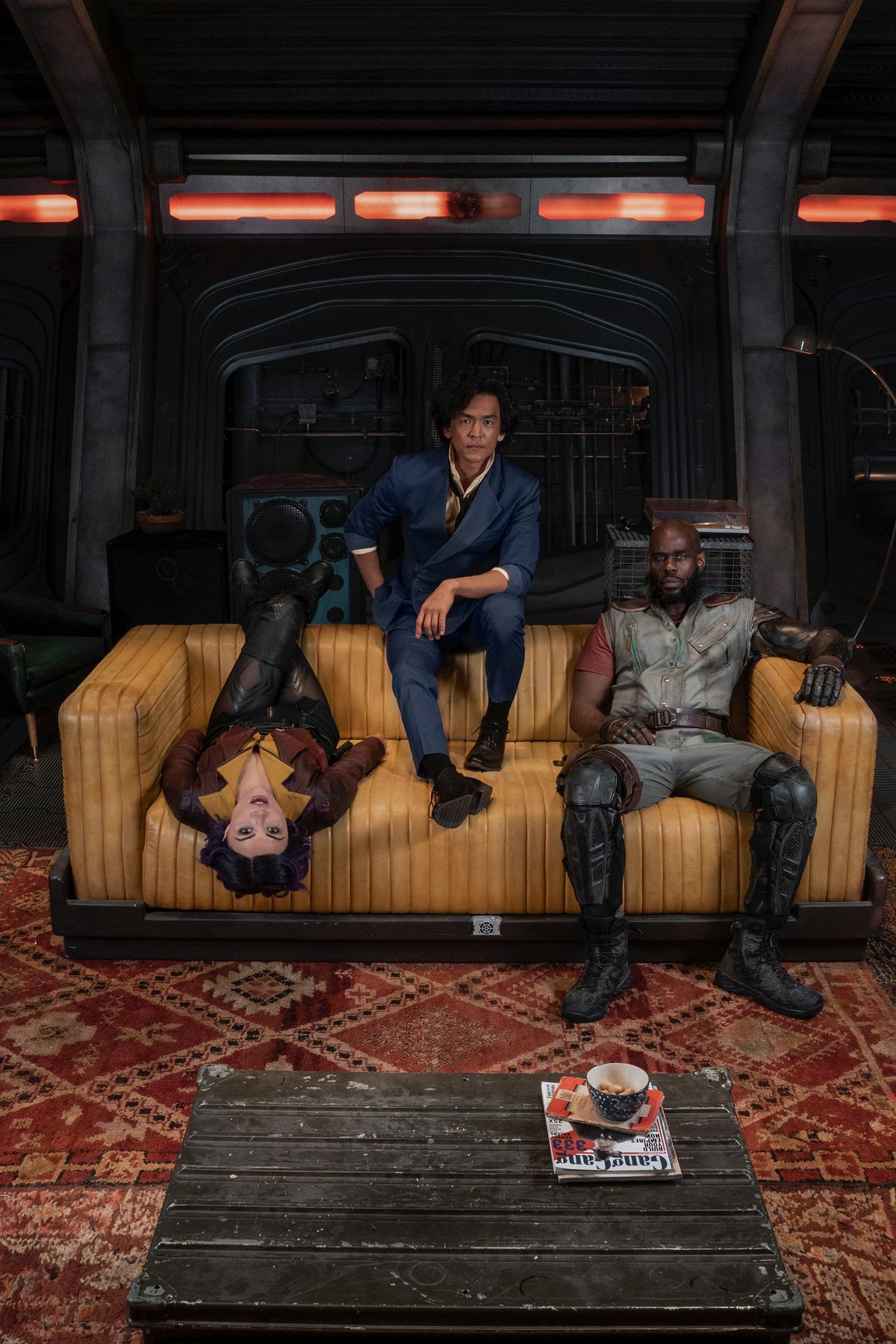 The cast of Netflix’s Cowboy Bebop sitting on a couch
