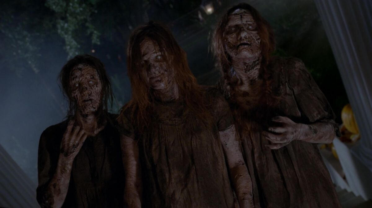 three rotting zombies