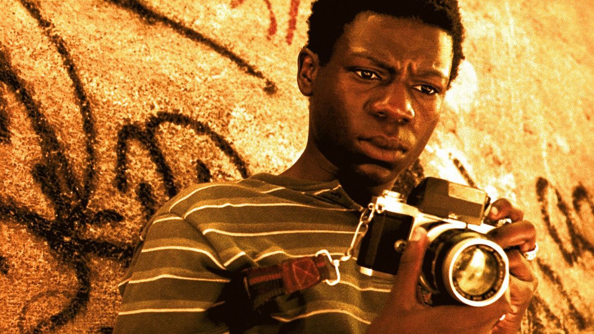 Rocket contemplating his camera in City of God.