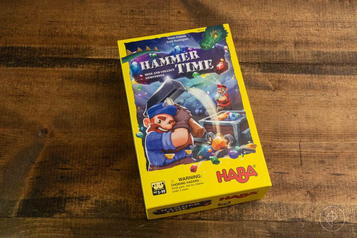 Box art for Hammer Time showing a dwarf swinging a hammer inside a mine. In the corner a green dragon looks on.