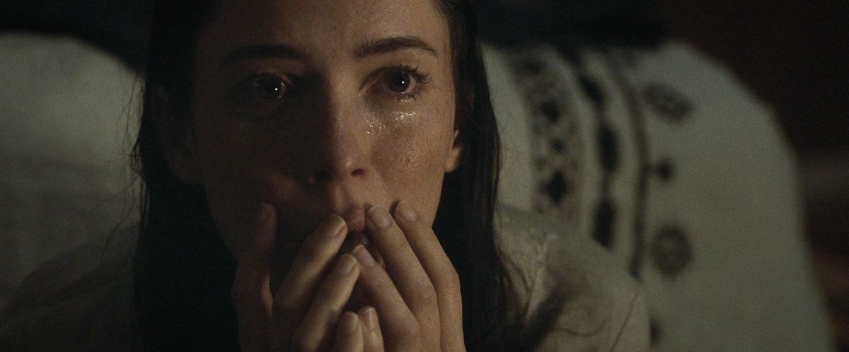 Rebecca Hall in The Night House, looks up in horror