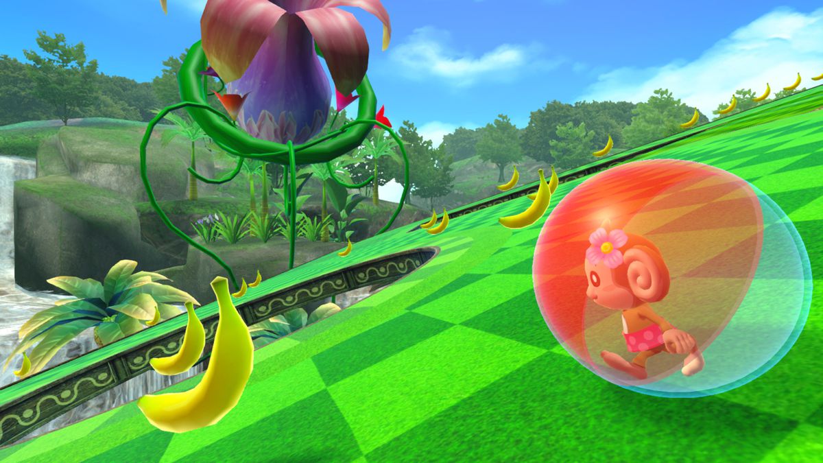 A character rolls around in a ball, collecting bananas