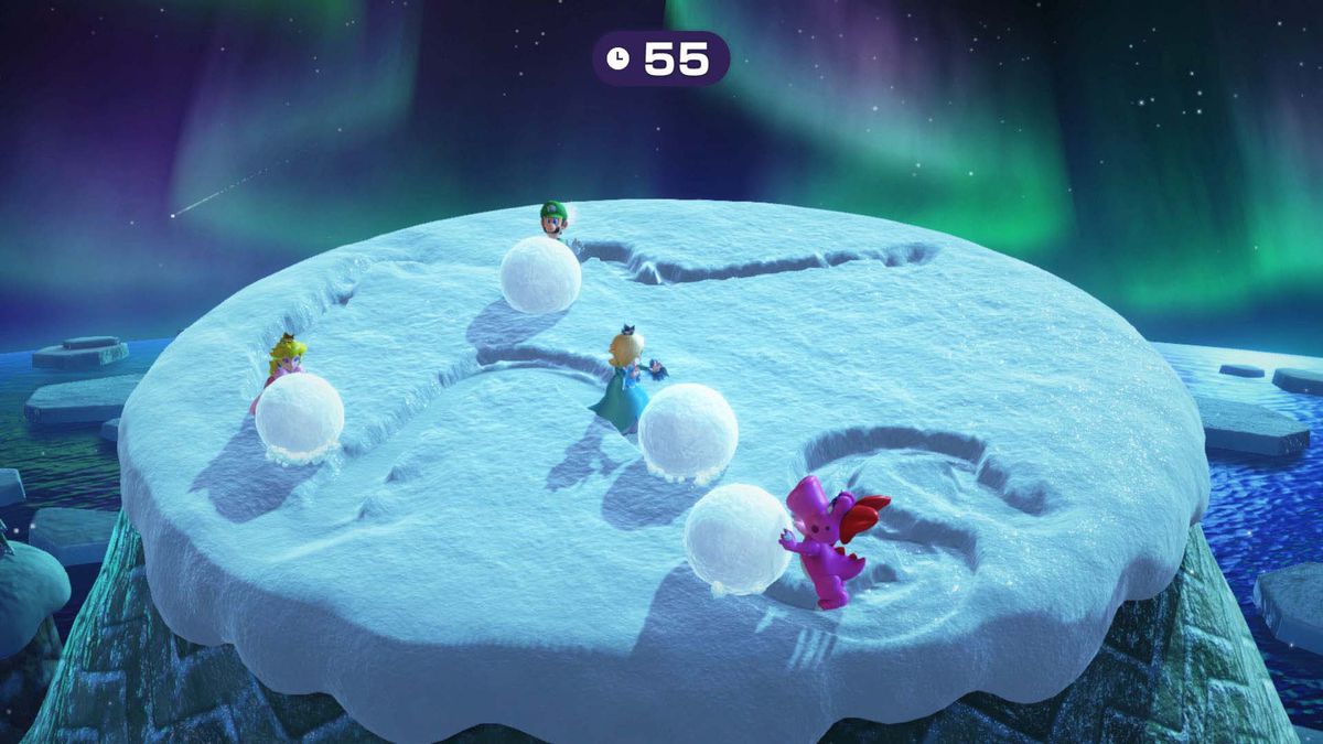 Luigi and friends push snowballs around a platform in Mario Party Superstars